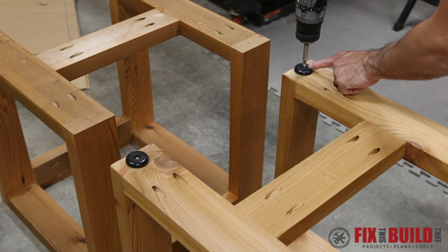 attaching rubber feet to a side table