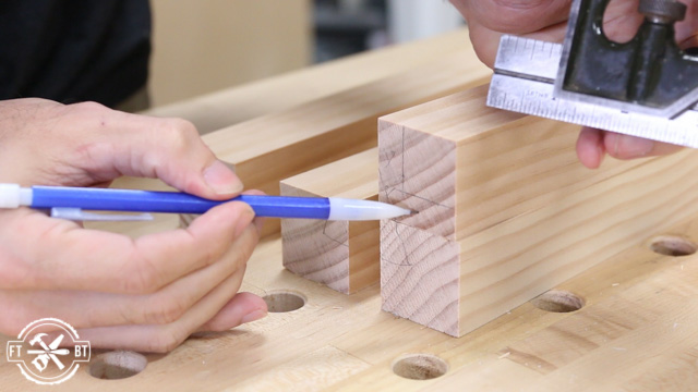 marking wood table legs with pencil