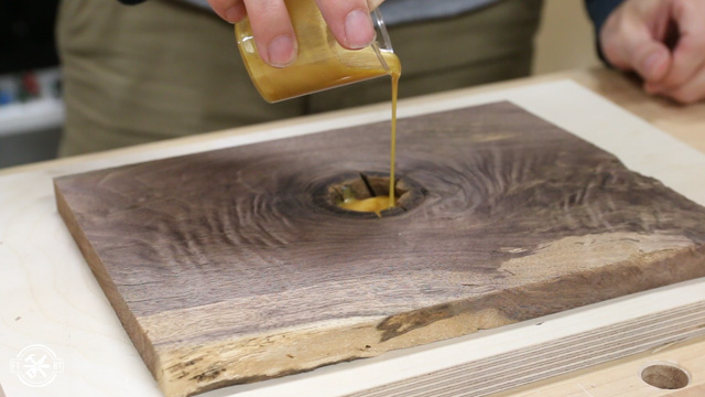 filling a knothole with epoxy