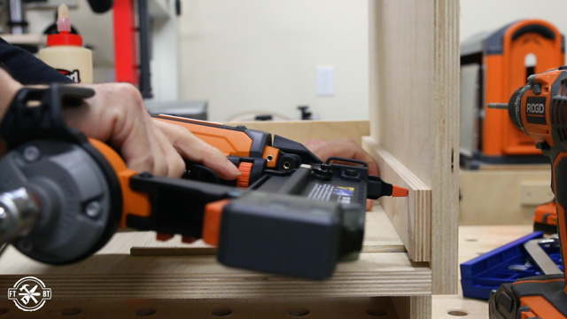 gluing ad brad nailing spacers to the side of cabinet