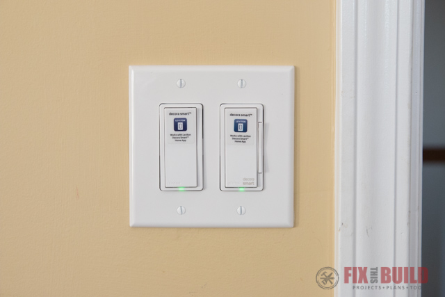 smart light switches on yellow wall