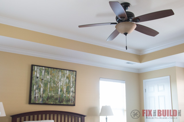 ceiling fan in yellow room