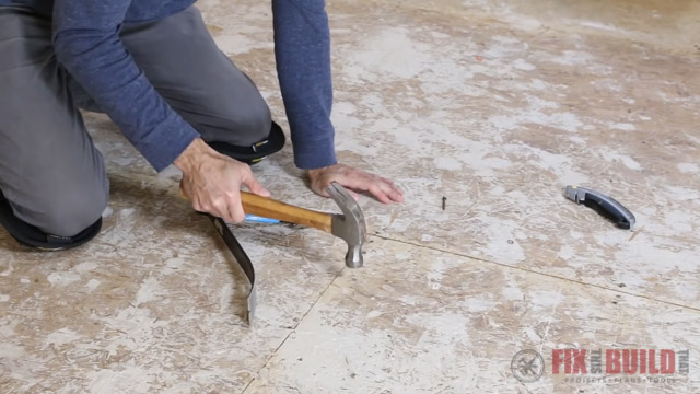 Hammer down nails into subfloor