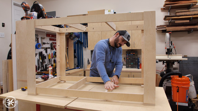 putting lower frame into base of outfeed table