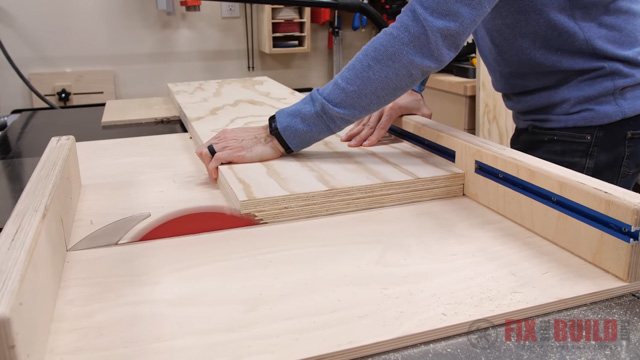 cutting wood with table saw sled