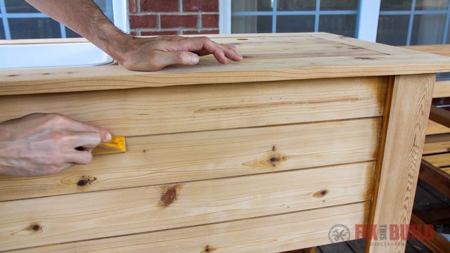 sanding wood with a hand sander