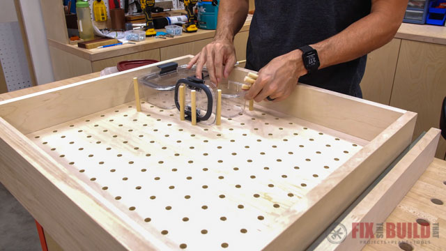 putting dowels in pegboard