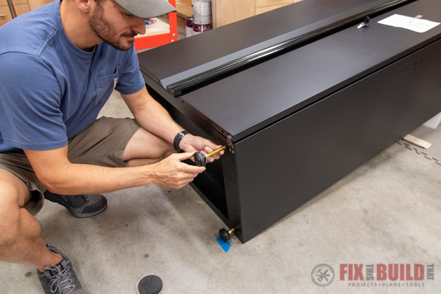 leveling the feet of garage storage cabinet