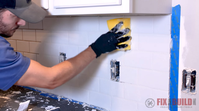 removing layer of grout from tile