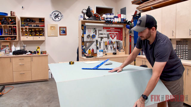 cutting drywall in workshop