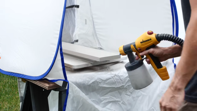spraying cabinet drawer fronts with paint