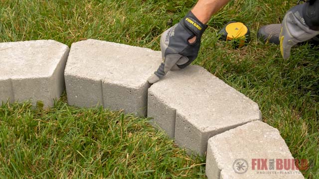 gaps between retaining wall stones in grass