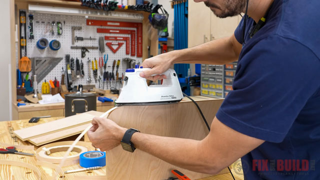 ironing edge banding onto edge of plywood