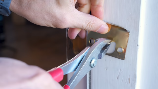 Adjusting the strike plate on a door frame