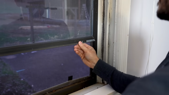 Lowering storm window in winter