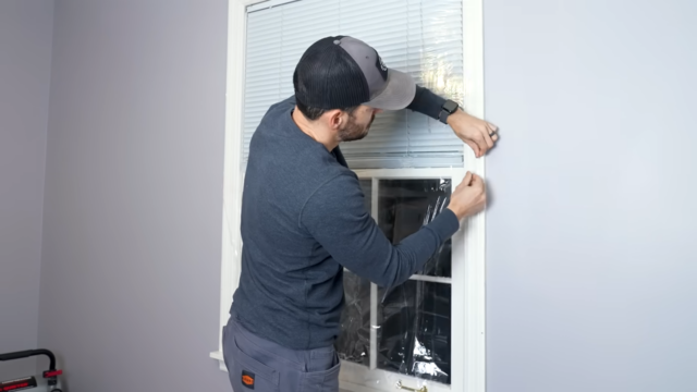 Applying plastic film to windows in winter