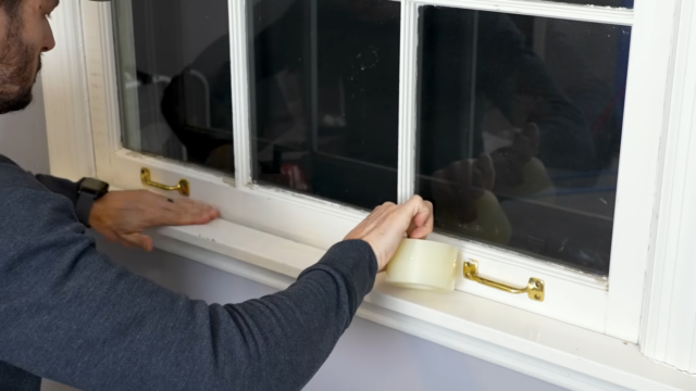 Sealing bottom of window with tape for winter